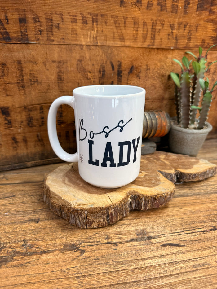 White ceramic coffee mug with "Boss Lady" slogan and curved side handle