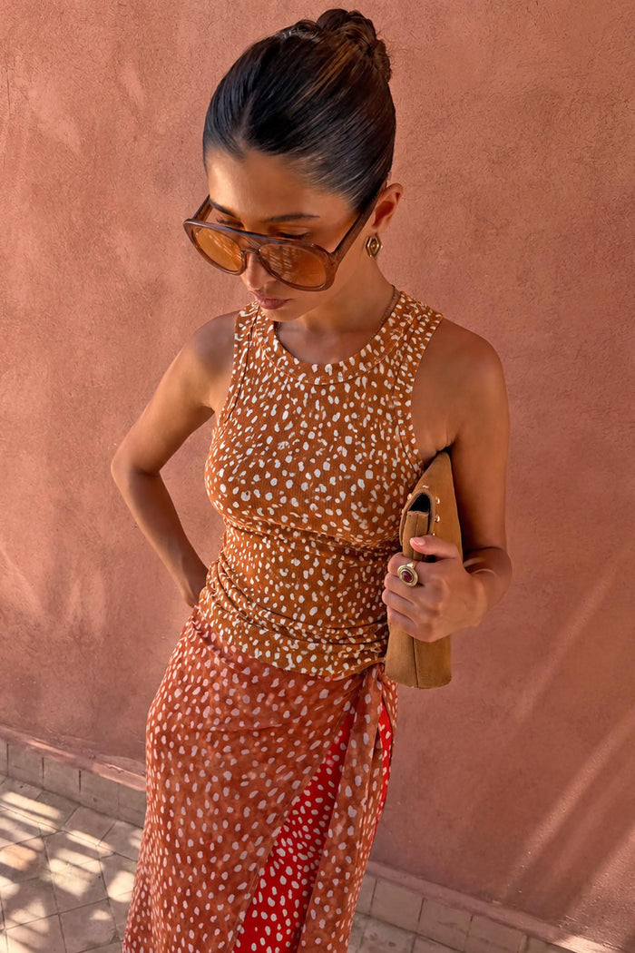 Fawn Rib Tank Top featuring white spots on tan ribbed fabric, styled with a matching wrap skirt.
