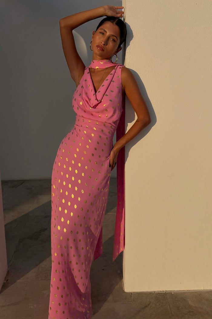 Pink Sophie Dress with shimmering gold flecks and a cowl neck, styled with a matching scarf on a model in sunlight.