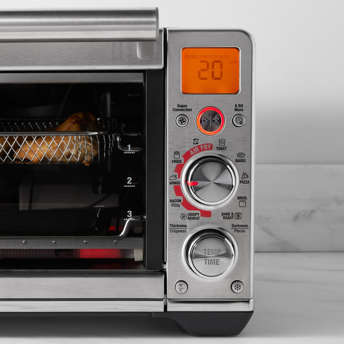 Breville Smart Oven™ Air Fryer Compact with 1507 Waffles and Toasters, showing the sleek black countertop appliance with digital controls.