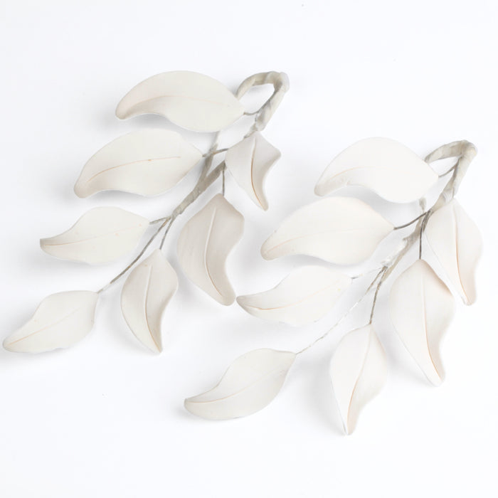 Caljava's ready-to-use white gum paste sugar flower leaf filler, ideal for cake decorating, wedding cakes, and birthday cakes. Perfect for adding elegant, professional touches to your creations.