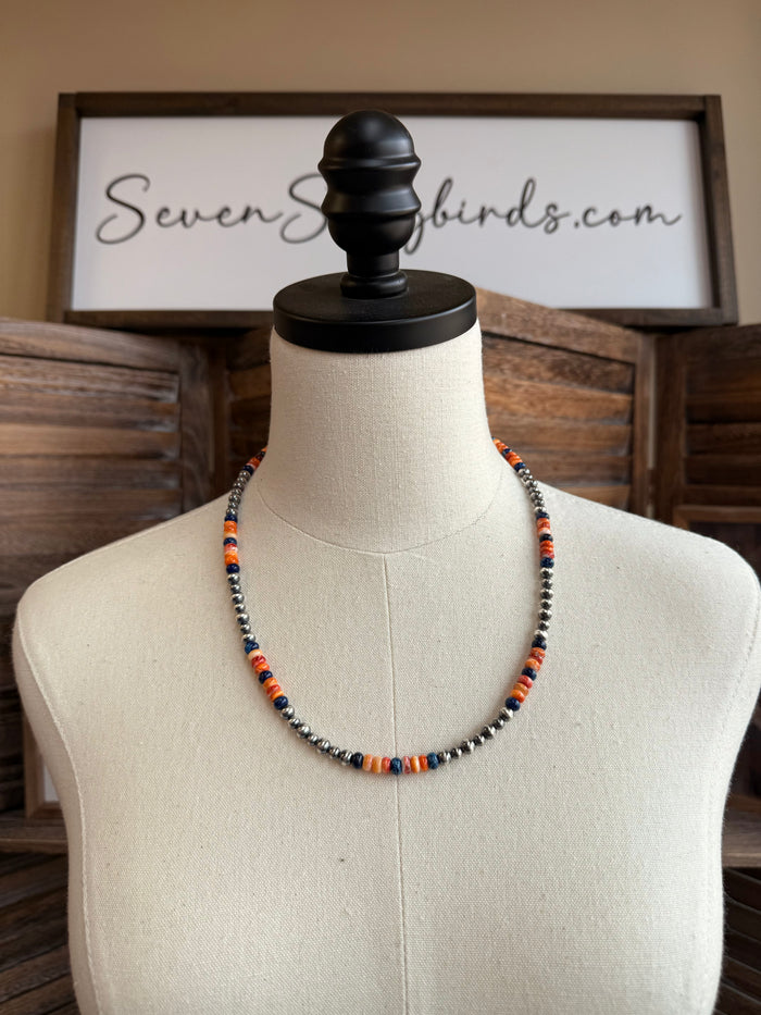 Multicolor spiny oyster beaded sterling necklace on mannequin, silver chain and round beads