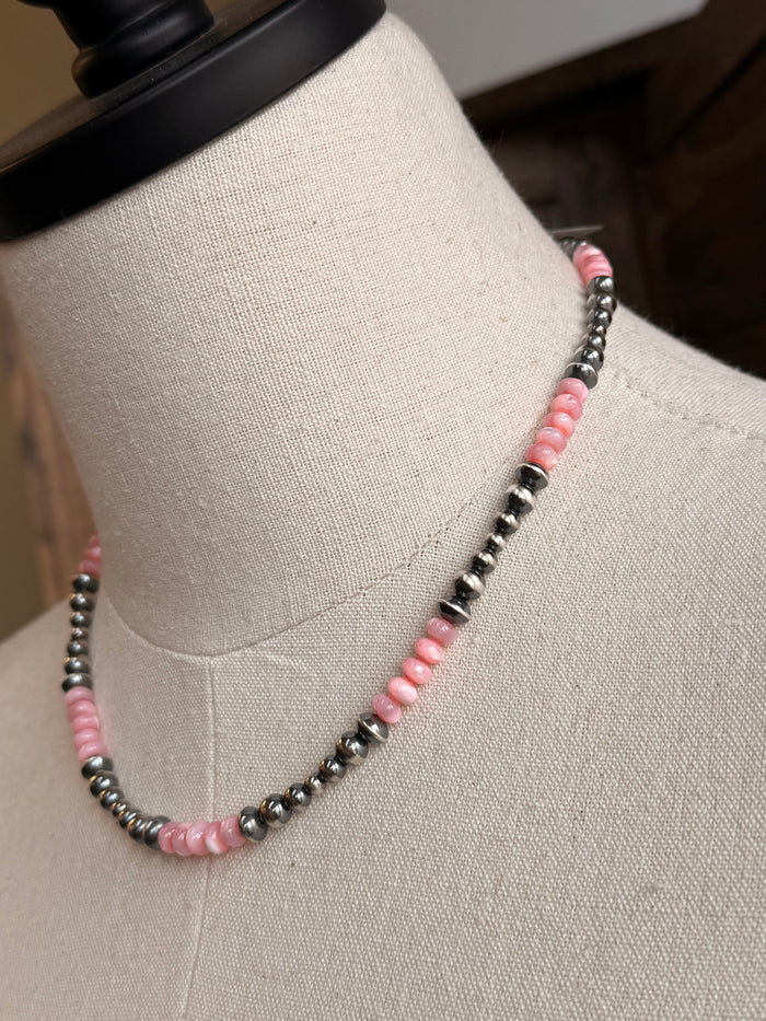 Pink mother-of-pearl sterling bead necklace detail with pink beads and silver-tone beads