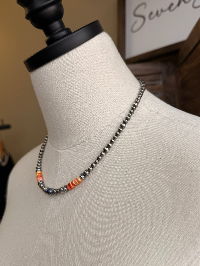 Side view of sterling bead necklace with blue jasper and orange spiny oyster stones