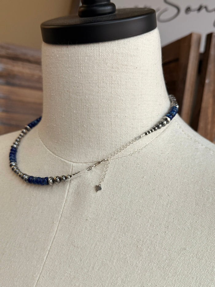 Blue jasper bead necklace with sterling silver chain and small dangling charm