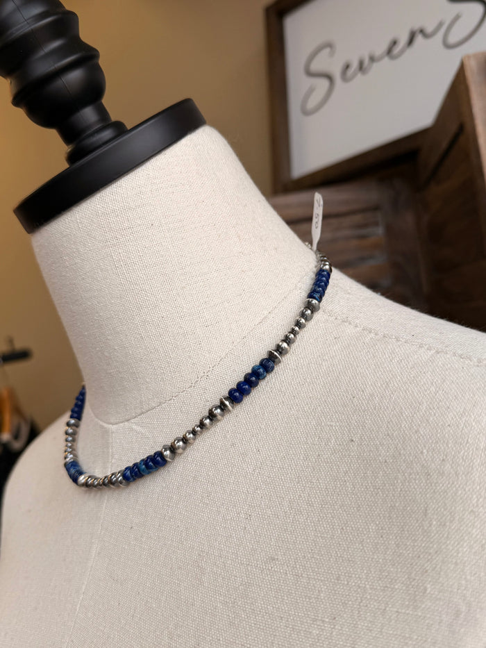 Side view of blue jasper bead necklace with sterling silver chain