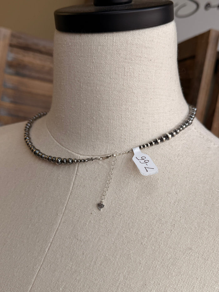 Sterling bead necklace with blue and orange stones and small dangling charm