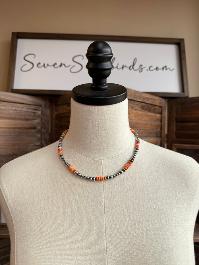 Orange spiny sterling bead necklace with silver-tone round spacers