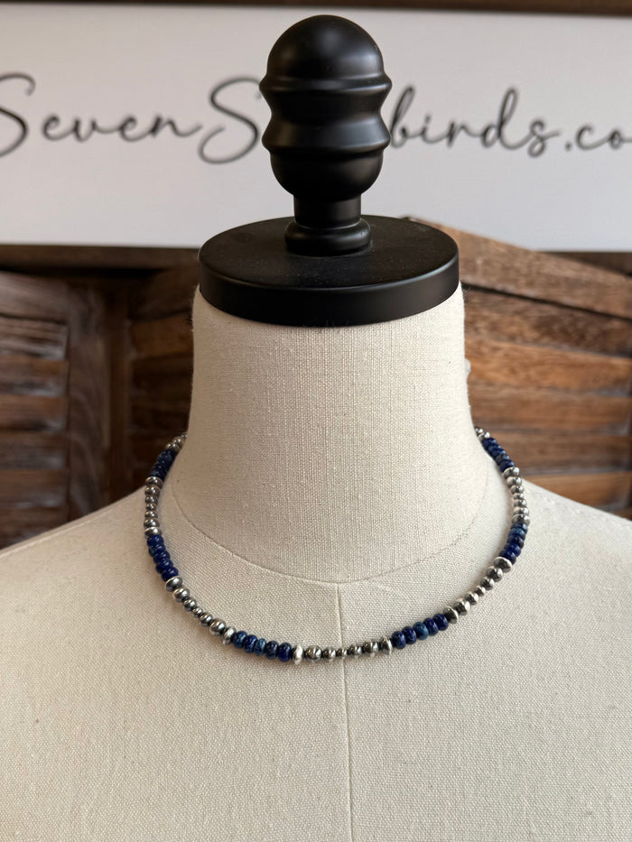 Blue jasper bead necklace with sterling silver chain on mannequin bust