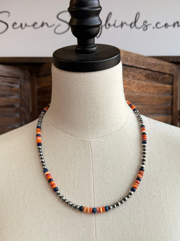 Multicolor spiny oyster sterling necklace with silver-toned beads on mannequin