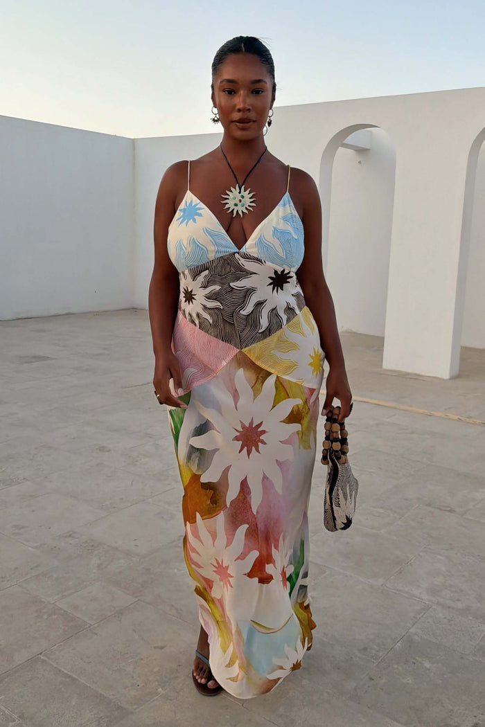 Abstract Soleil Emilia Dress featuring a pastel sun print and panel detailing, perfect for wedding guest dressing.