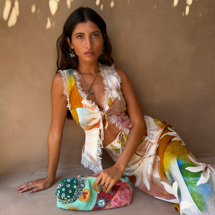 Abstract Soleil Maisie Top featuring the soleil print, white lace trims and a tie-front, styled as a summer co-ord.