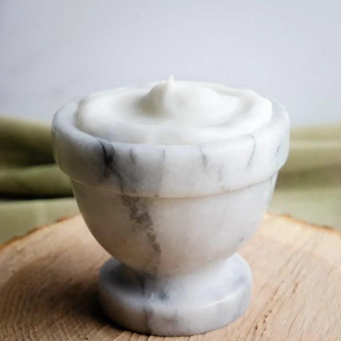 Rustic Strength, Avocado Lotion in a marble dish