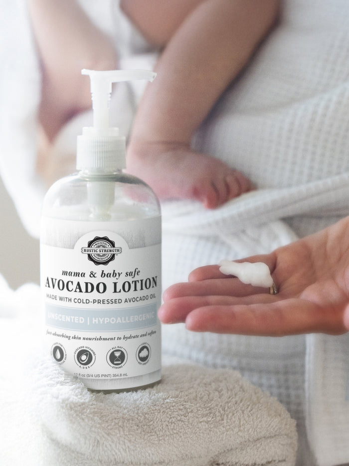 Rustic Strength, Avocado Lotion, 16oz Plastic, Mama + Baby Safe with Mama + Baby in background and lotion in hand
