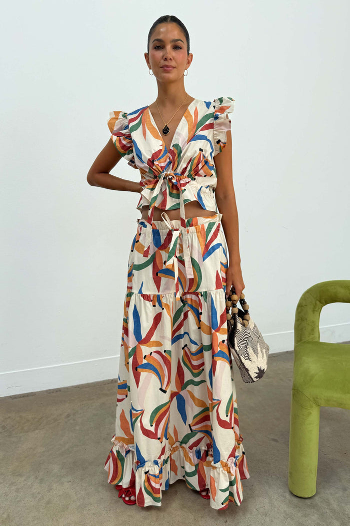 Banana Saige Skirt in a multicolour banana print with tiered panels and a frill hem, styled as a cotton co-ord set.