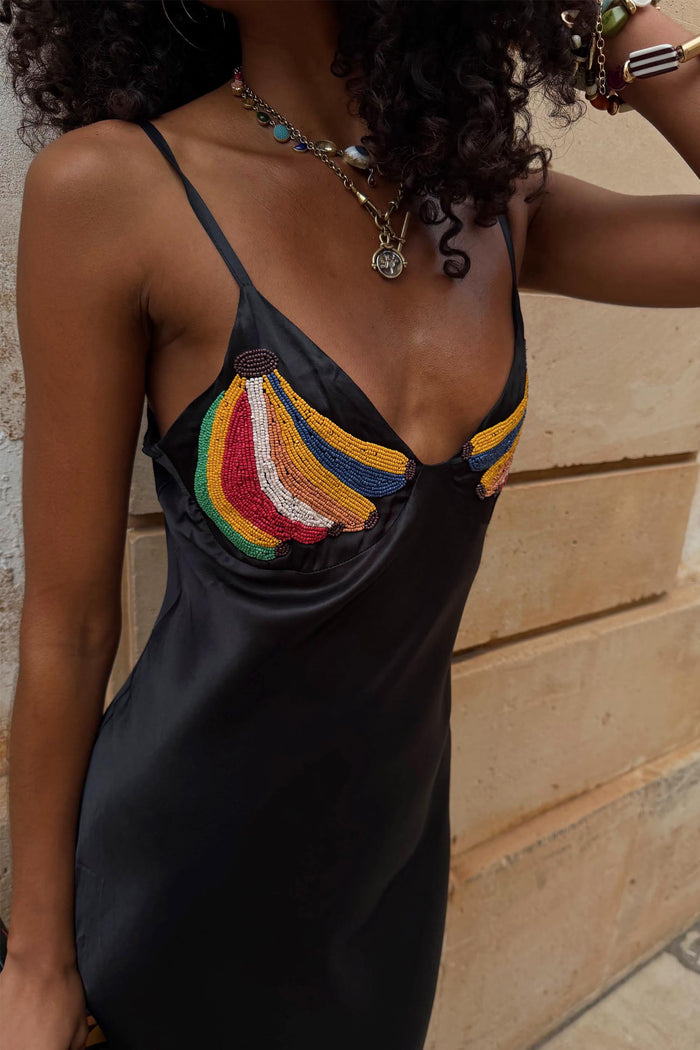 Black Banana Slip Dress featuring colourful beaded banana motifs on the bust, thin straps, and a soft V-neckline.