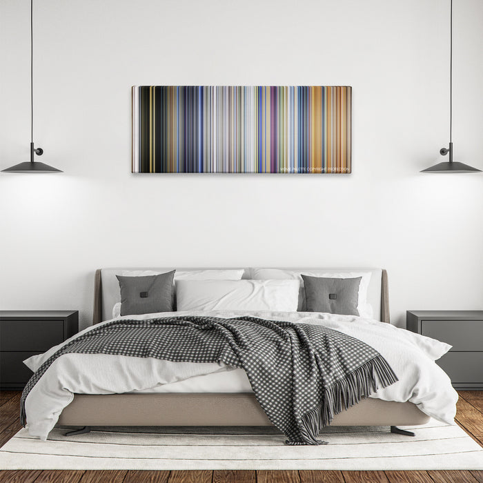 Black Adam color palette canvas above a bed, between two black pendant lamps