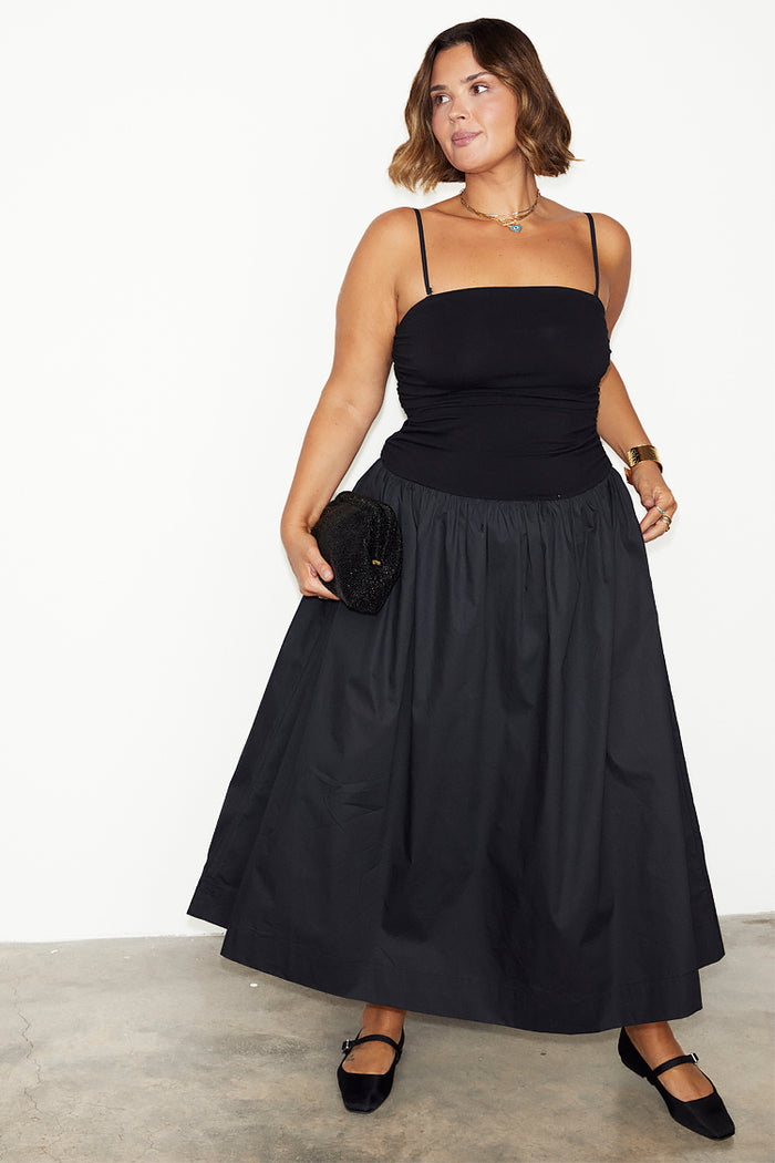 Black Lola Mid-axi Dress featuring a ruched jersey bodice, thin straps and a gathered cotton skirt.