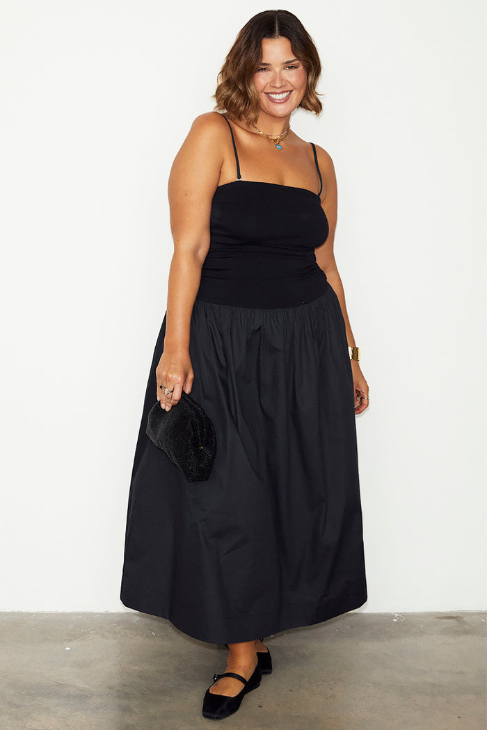 Black Lola Mid-axi Dress featuring a jersey bodice and cotton skirt, showcasing inclusive sizing and London design.