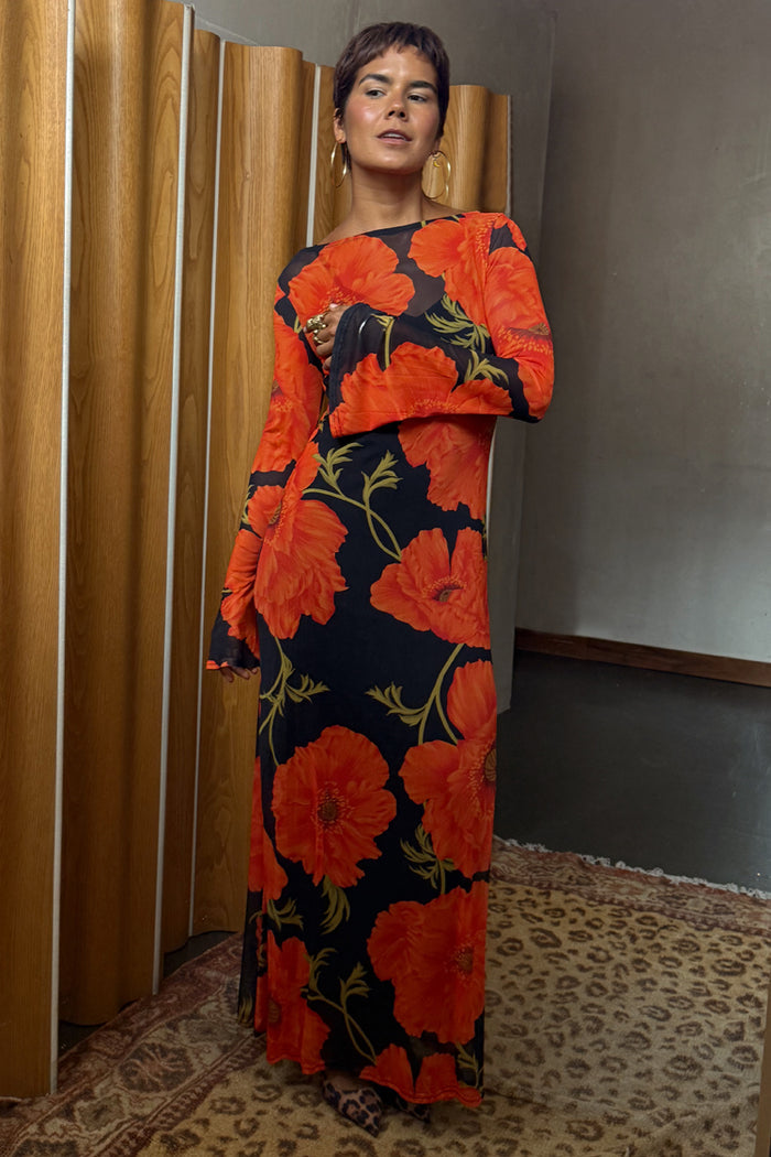 Black Poppy Aria Mesh Dress in sheer fabric with a bold red poppy print and long flared sleeves.