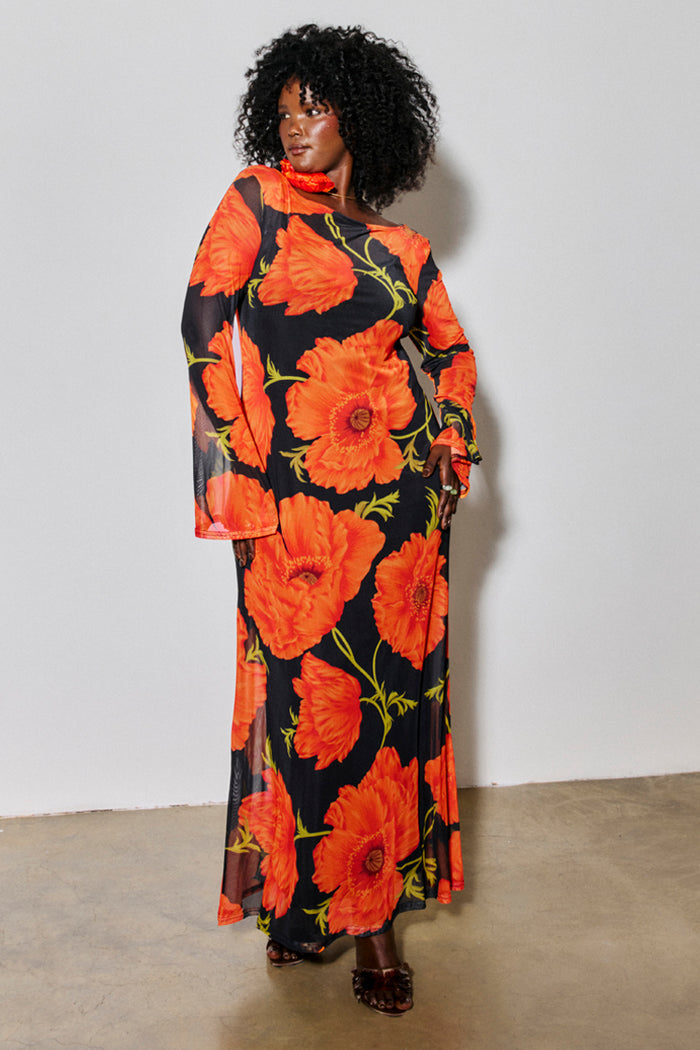 Black Poppy Aria Mesh Dress with a red poppy print and long sleeves on a size 18 model for inclusive sizing.
