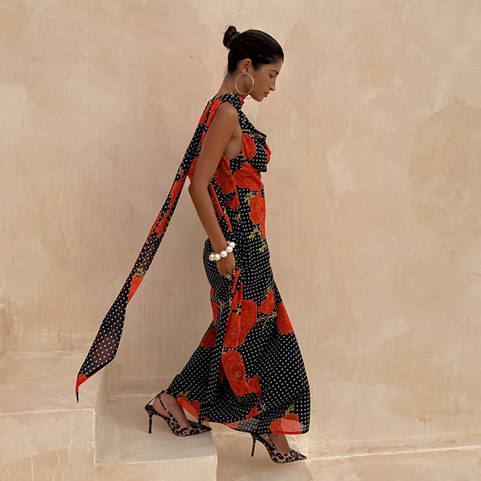 Black Poppy Sophie Dress featuring a red poppy and white polka dot print with a statement trailing scarf.
