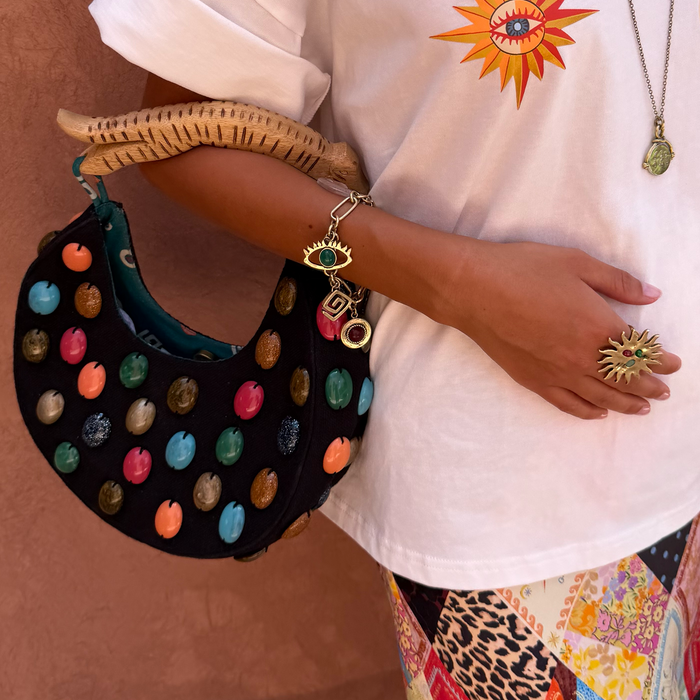 Black Stone Beaded Bag featuring multicoloured stones and a sculpted wooden handle, styled with a sun graphic t-shirt.