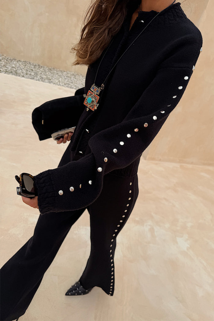 Black Studded Cardigan with silver sleeve studs, paired with matching knit trousers for a textured co-ord look.