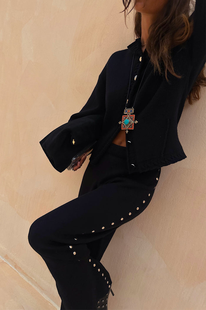 Black Studded Knit Trousers and Cardigan co-ord with silver metal studs along the sides and buttons.