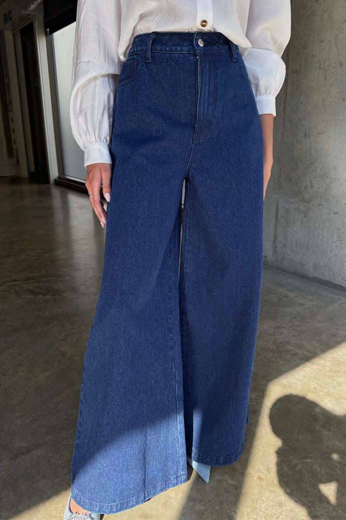 Blue Denim Pallazzo Jan Jean in indigo featuring a voluminous wide leg and high-waisted silhouette.