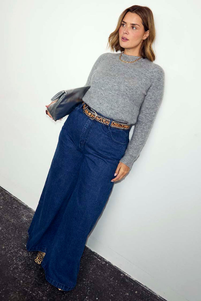Blue Denim Pallazzo Jan Jean with a wide-leg fit, styled with a grey knit and leopard print belt on a size 18 model.