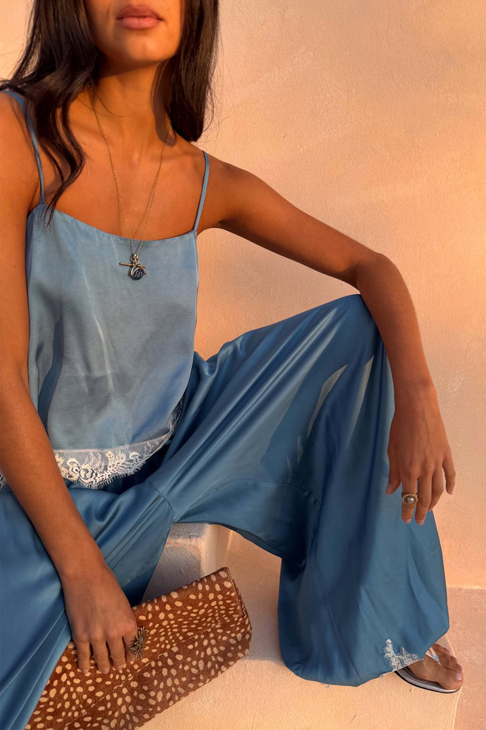 Blue Lace Swing Cami with a satin-esque base and lace-trimmed hem, styled as a co-ord with matching trousers.