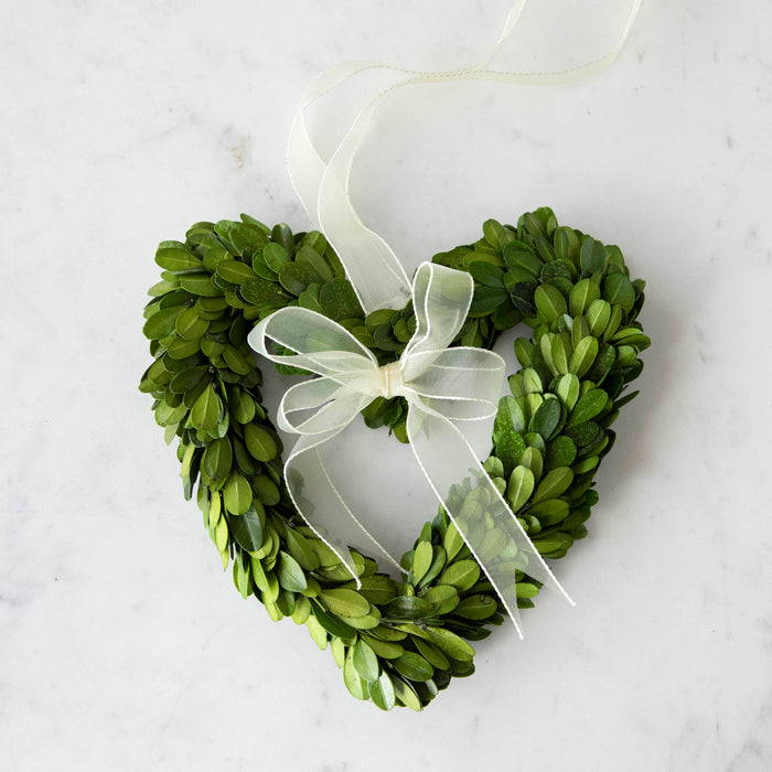 Three heart-shaped preserved Boxwood Wreath Hearts with Ribbons by Mills Floral Company on a white background.