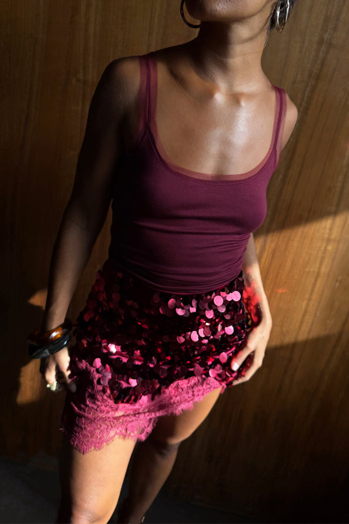 Burgundy Teddy Vest in wine with mesh neckline detailing, paired with a sequinned and lace mini skirt.