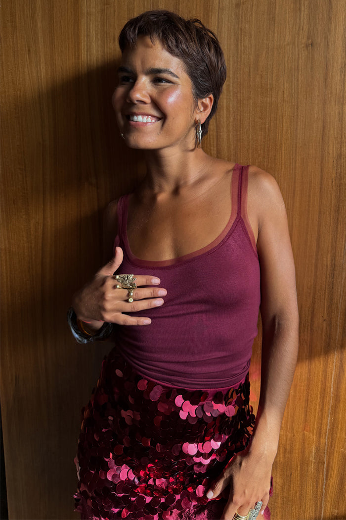 Burgundy Teddy Vest with mesh detailing at the neckline, paired with a sequinned skirt for evening styling.