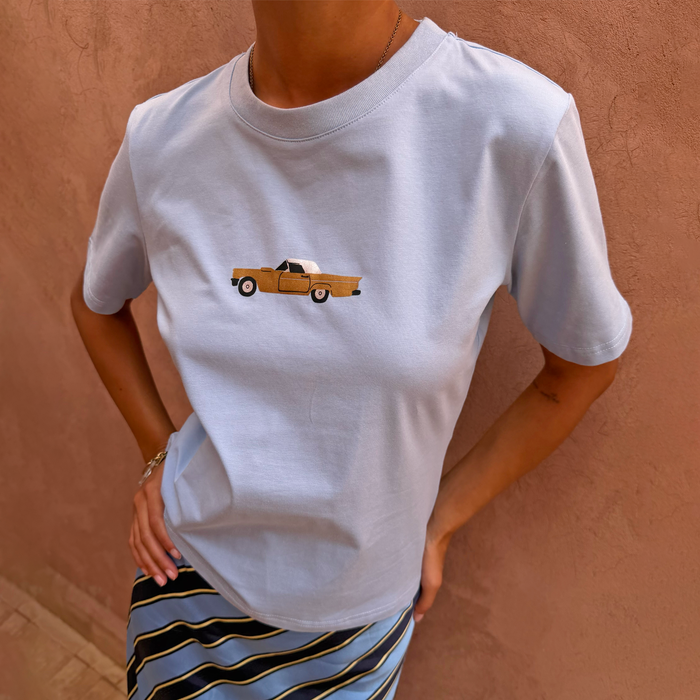 Blue Cadillac Baby T-Shirt featuring a retro car motif, a stretch cotton wardrobe staple.
