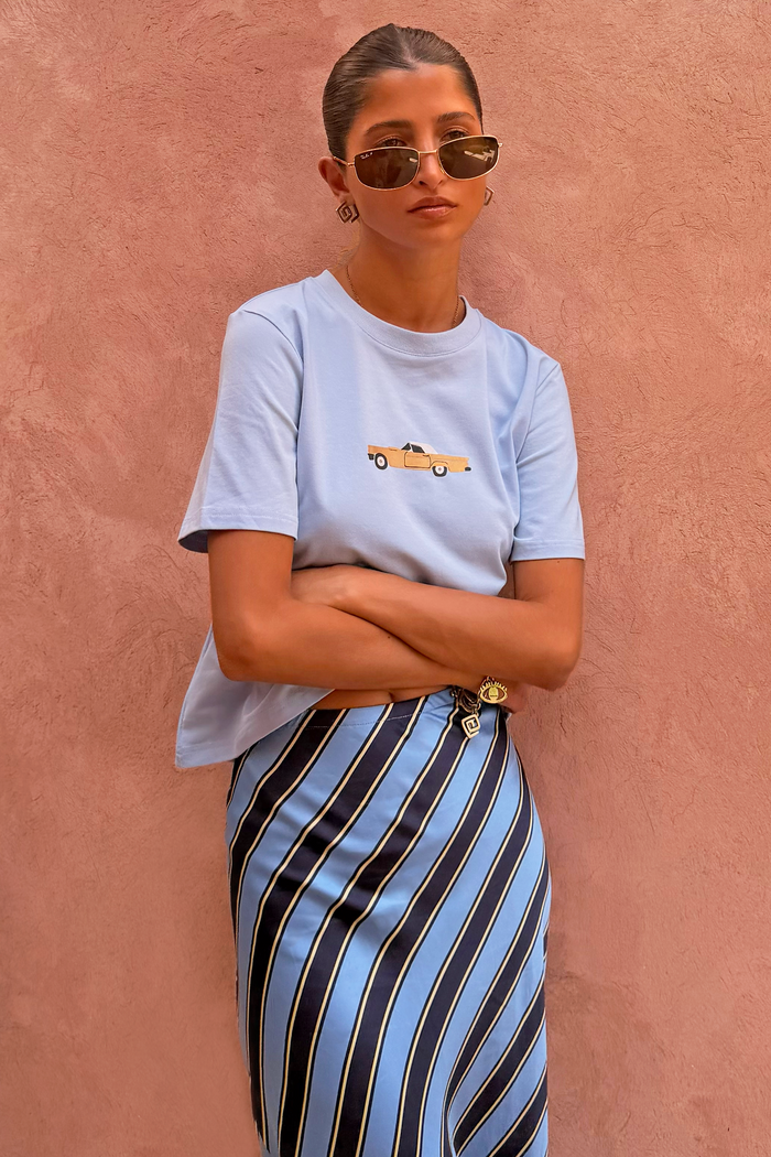 Light blue cotton Cadillac Baby T-Shirt with a retro car motif and striped skirt, designed in London.