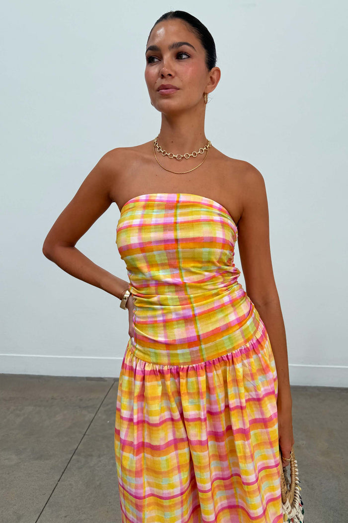Check Lola Mid-axi Dress in a yellow, pink and orange check print with a strapless ruched bodice.