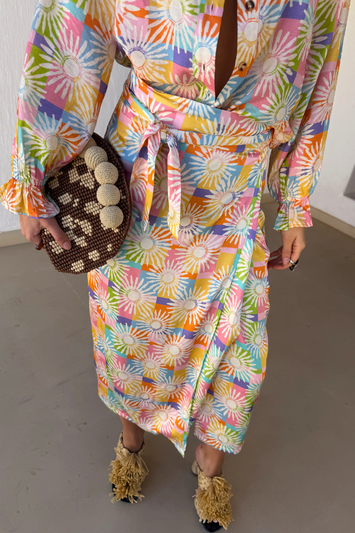 Check Sun Jaspre Skirt in a colourful checkered sun print with a wrap tie fastening and matching shirt.