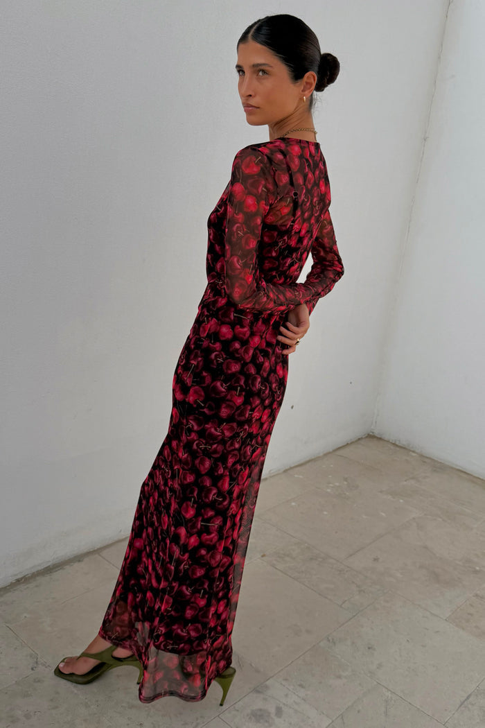 Cherry Mesh Soho Dress featuring a red digital cherry print, long sleeves and sheer mesh fabric.