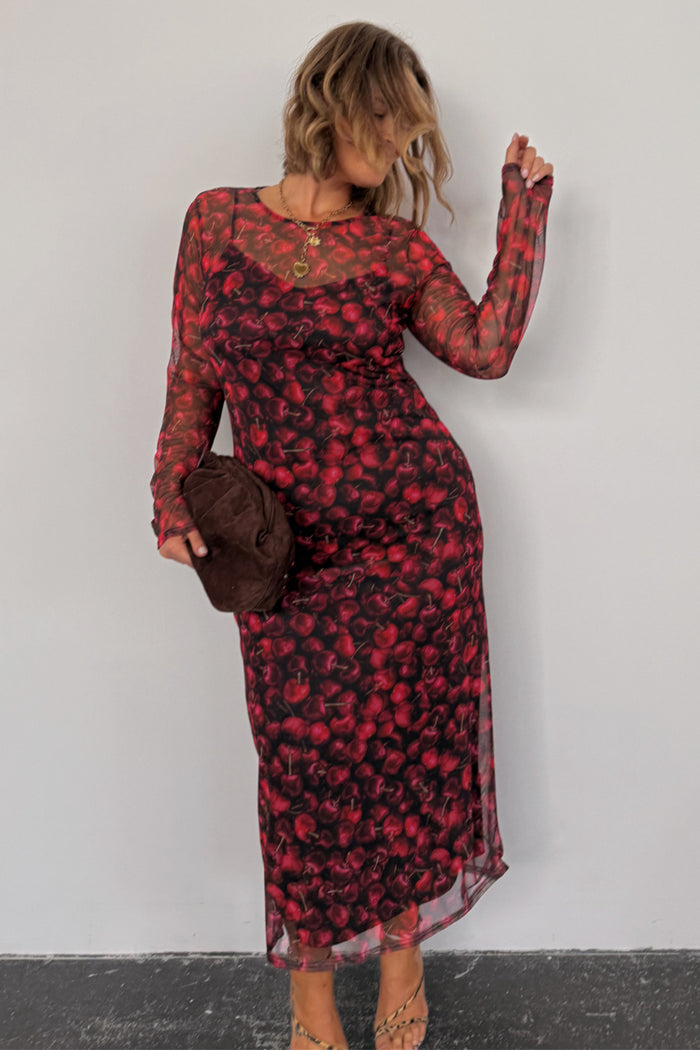 Cherry Mesh Soho Dress in a red digital cherry print and sheer mesh, highlighting inclusive sizing.
