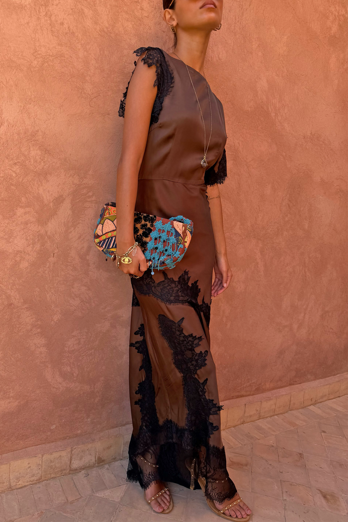 Chocolate Fearne maxi dress with black lace panels and cap sleeves, styled with a beaded clutch bag.