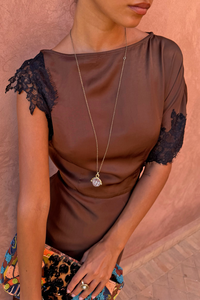 Chocolate and Black Lace Fearne Dress with cap sleeves and a round neckline, styled with a gold pendant.
