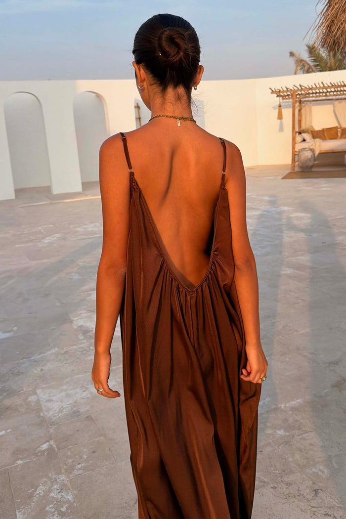 Chocolate Balloon Jumpsuit featuring a deep V back, gathered detail and slim straps in a draped silhouette.