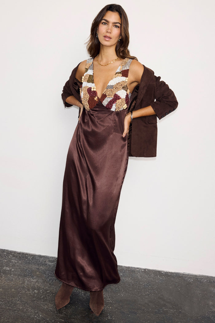 Chocolate Beaded Allegra Dress with a multi-coloured beaded bodice and satin skirt, styled with a brown blazer.