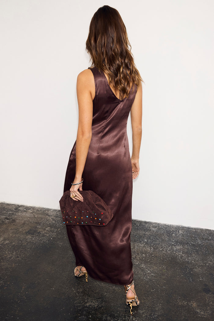 Chocolate Beaded Allegra Dress in glossy brown satin with a V-back, styled with a matching beaded clutch.