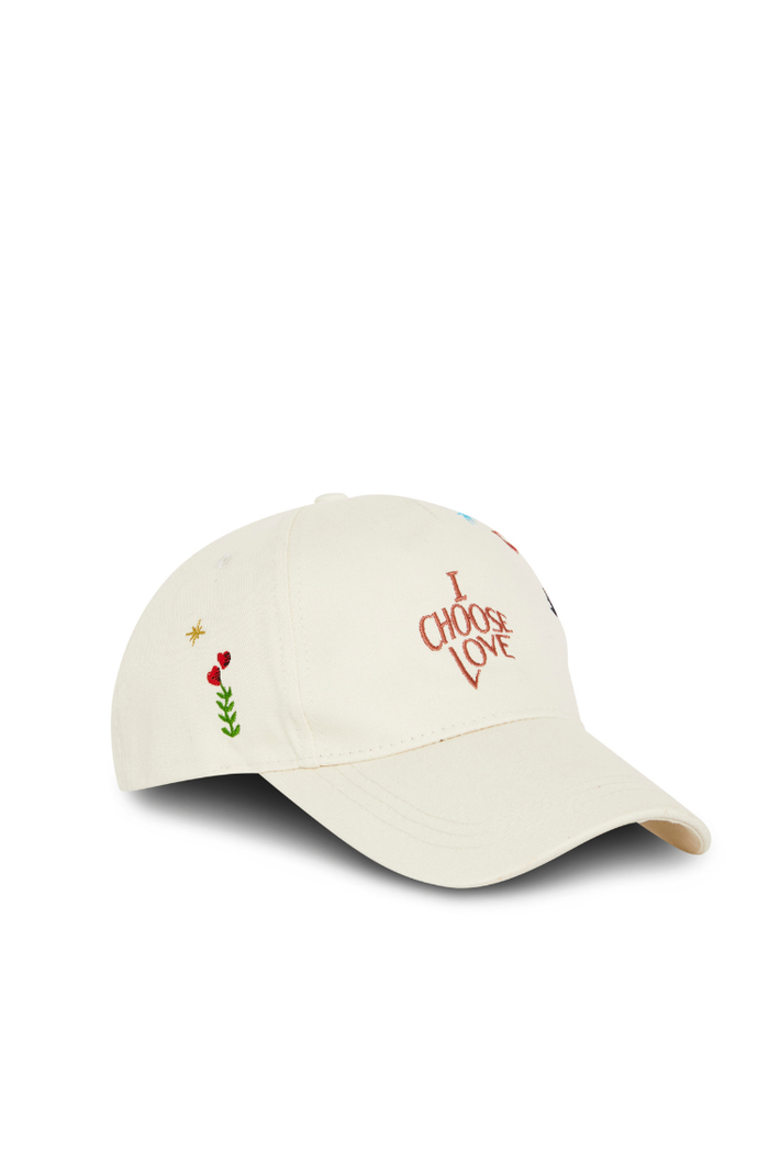 Cream Choose Love baseball cap featuring red embroidered lettering and colourful heart motifs on the side.