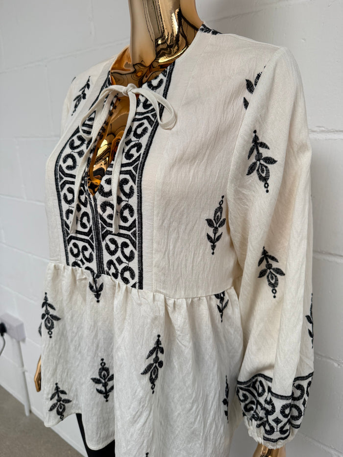 Cream Peplum Tie Up Top With Black Detailing