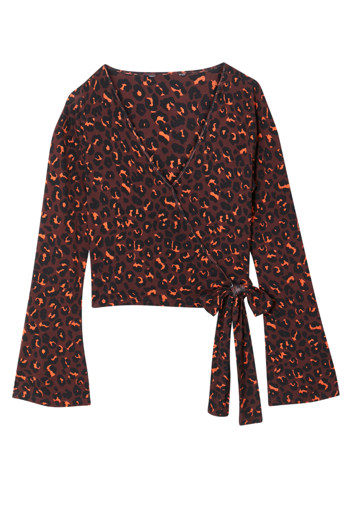 Dark Leopard Ballet Wrap top with orange accents, long flared sleeves and a side tie fastening.