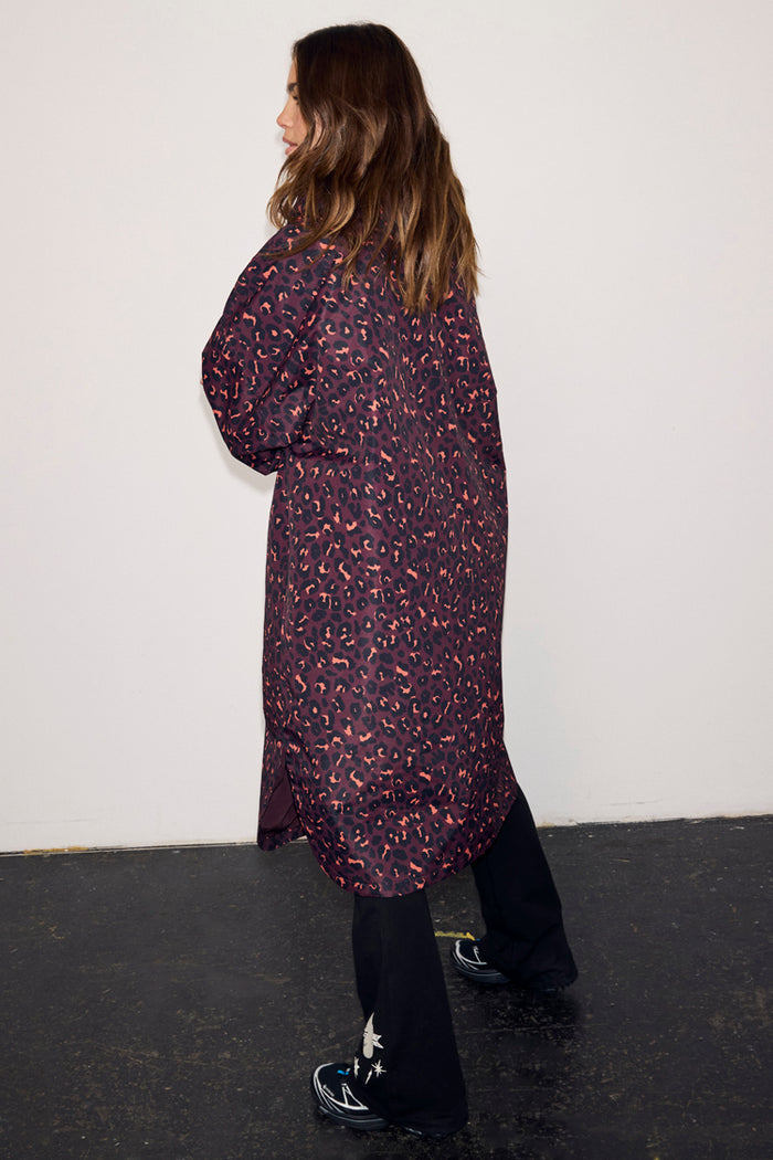 Dark Leopard Rain Mac in iconic leopard print and relaxed fit, shown from the back on a model.